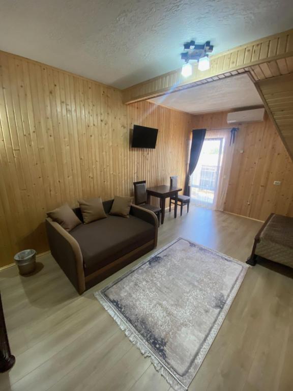 TV a/nebo společenská místnost v ubytování Holi Day