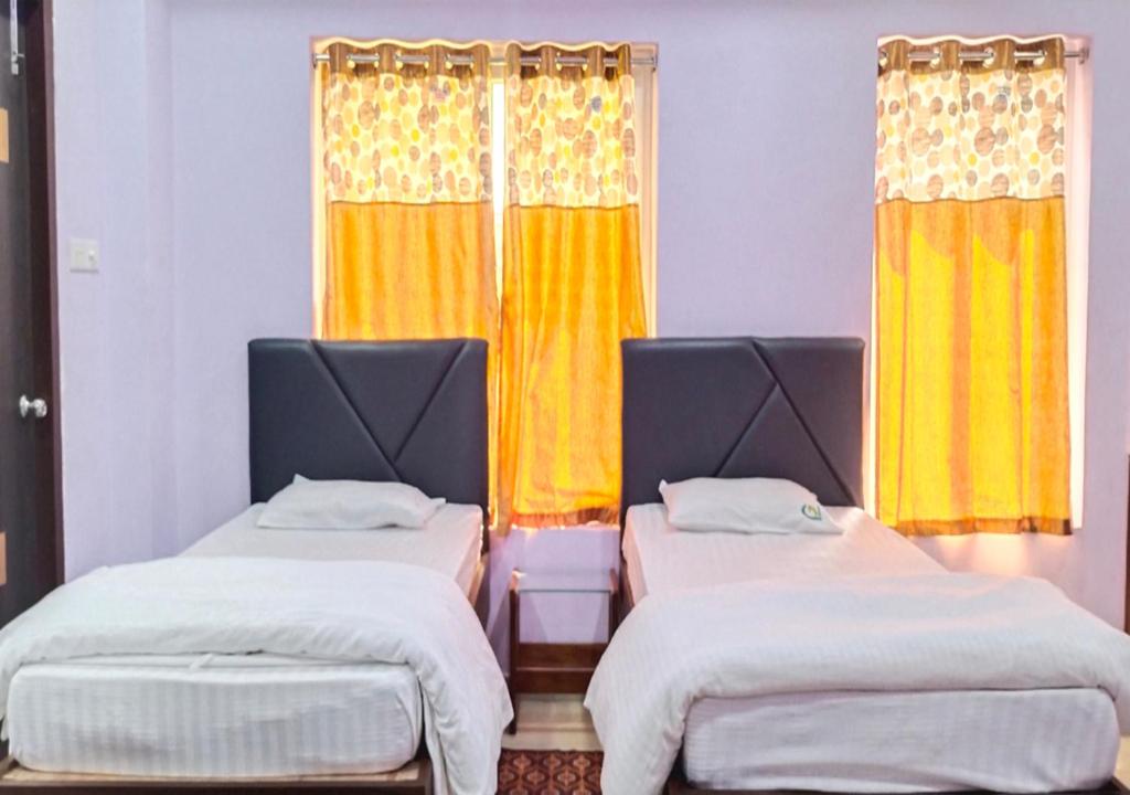 Postel nebo postele na pokoji v ubytování HOTEL PURI GREENS