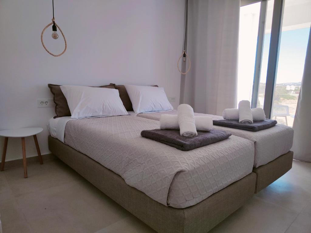 Postel nebo postele na pokoji v ubytování Alpha Villas