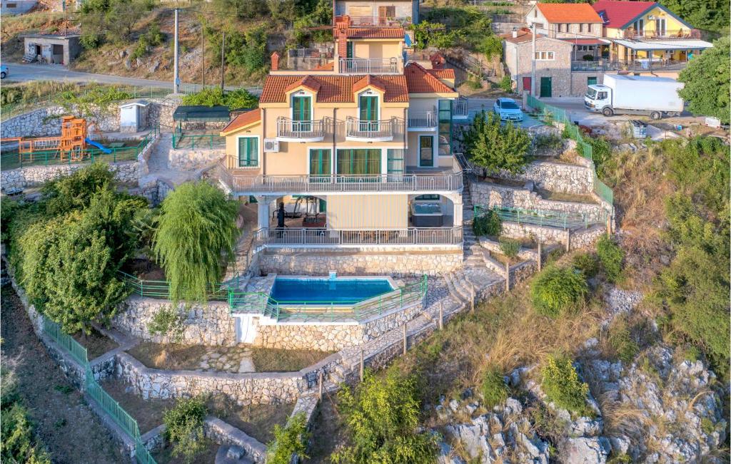 an aerial view of a house on a cliff at Lovely Home In Mirlovic Polje With Sauna in Mirlović-Polje