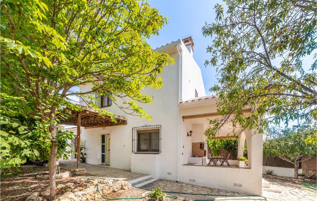 a white house with a white tower at Gorgeous Home In Roda De Bara With Kitchen in Roda de Bará