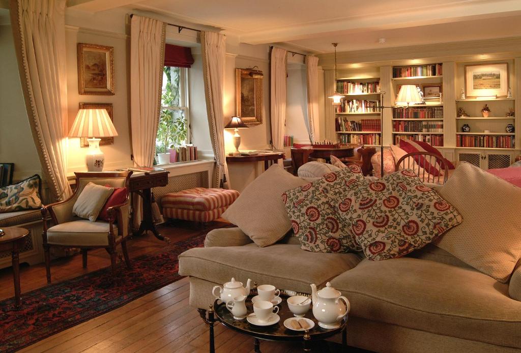 a living room with a couch and a table at The Royal Hotel in Comrie