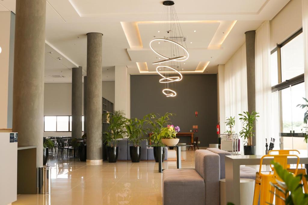 Posezení v ubytování Trento Hotel Guaíra by Unna