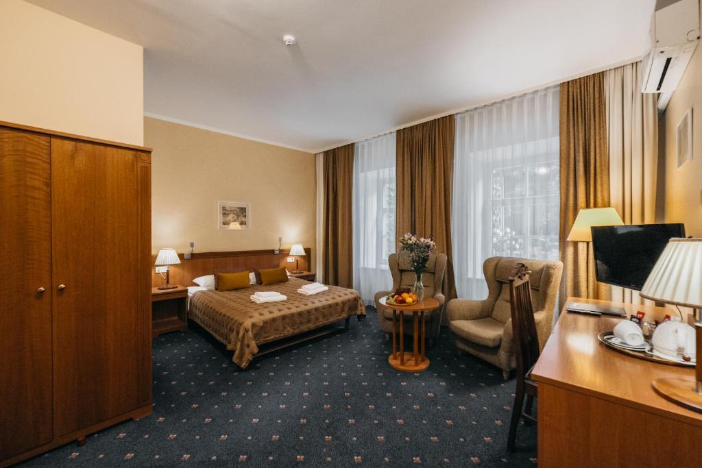Postel nebo postele na pokoji v ubytování Hotel Rinno