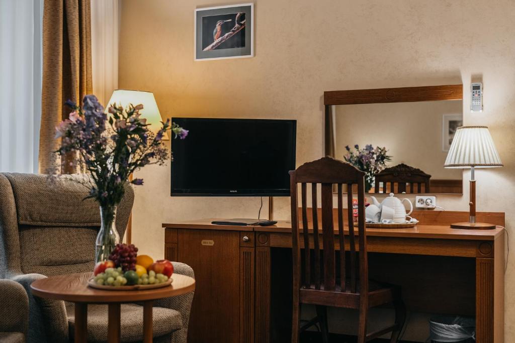 TV a/nebo společenská místnost v ubytování Hotel Rinno