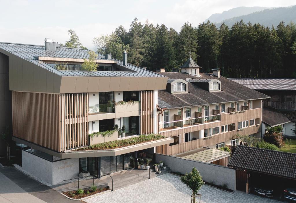 an aerial view of a building with trees in the background at Langwies Genussherberge in Hallein