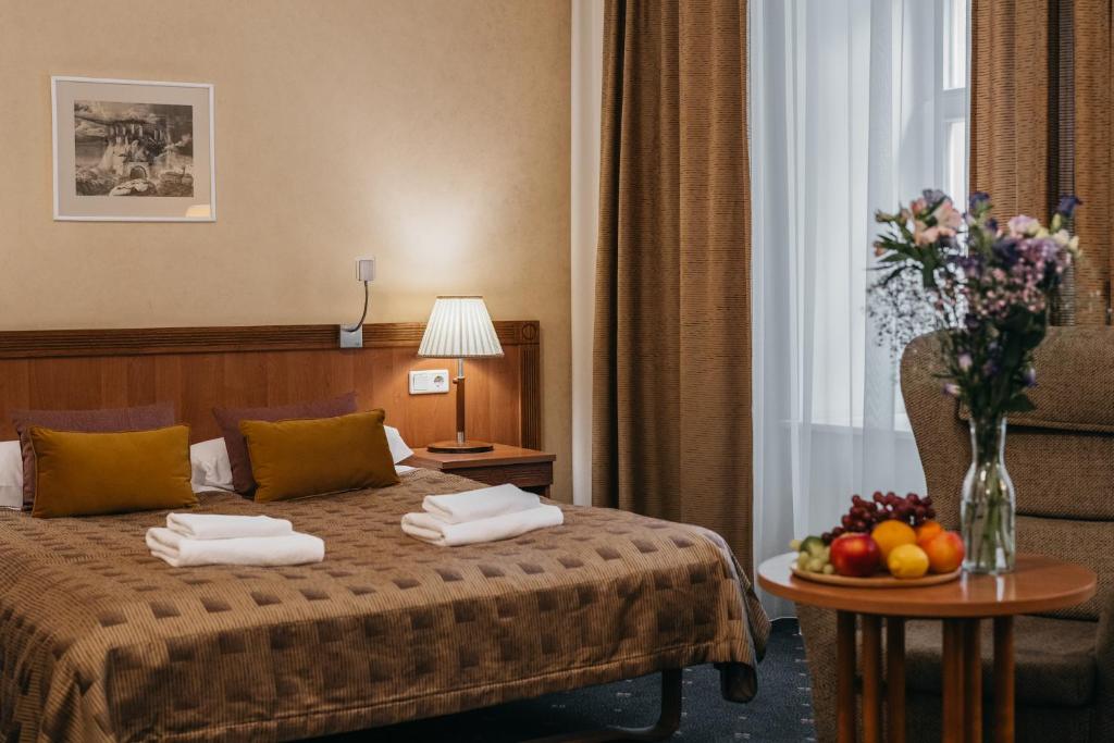 Postel nebo postele na pokoji v ubytování Hotel Rinno