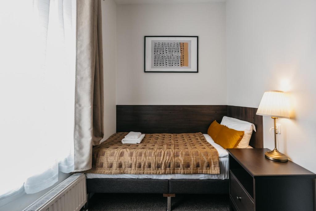 Postel nebo postele na pokoji v ubytování Hotel Rinno