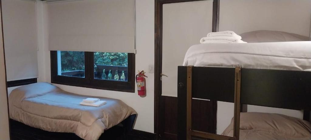 Postel nebo postele na pokoji v ubytování Cucu Haus Hostel
