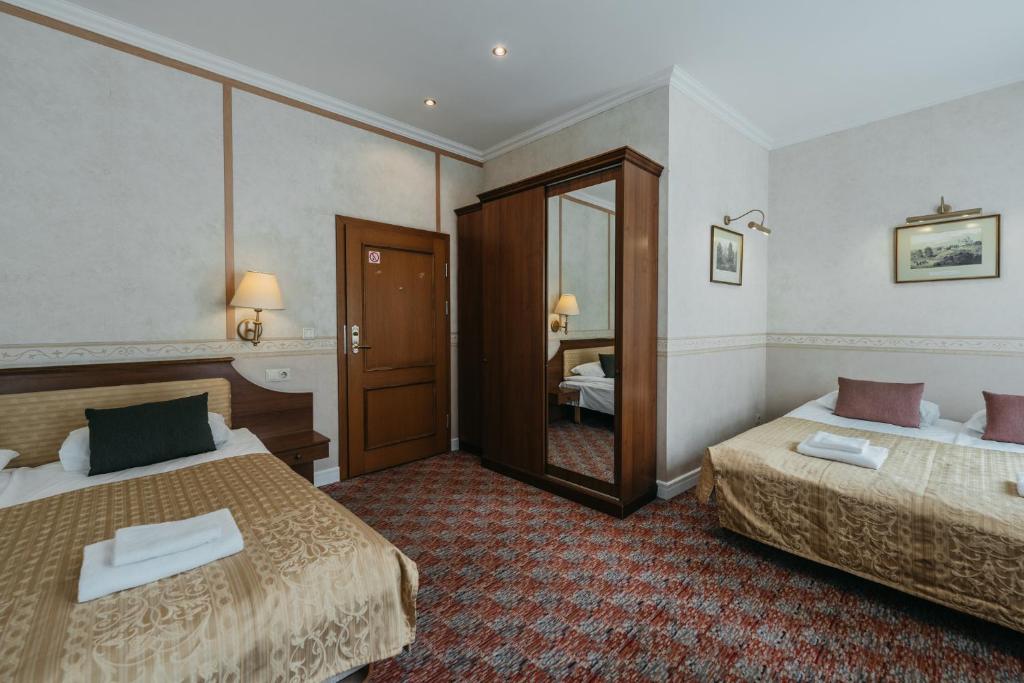 Postel nebo postele na pokoji v ubytování Hotel Rinno