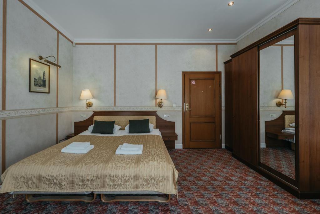 Postel nebo postele na pokoji v ubytování Hotel Rinno