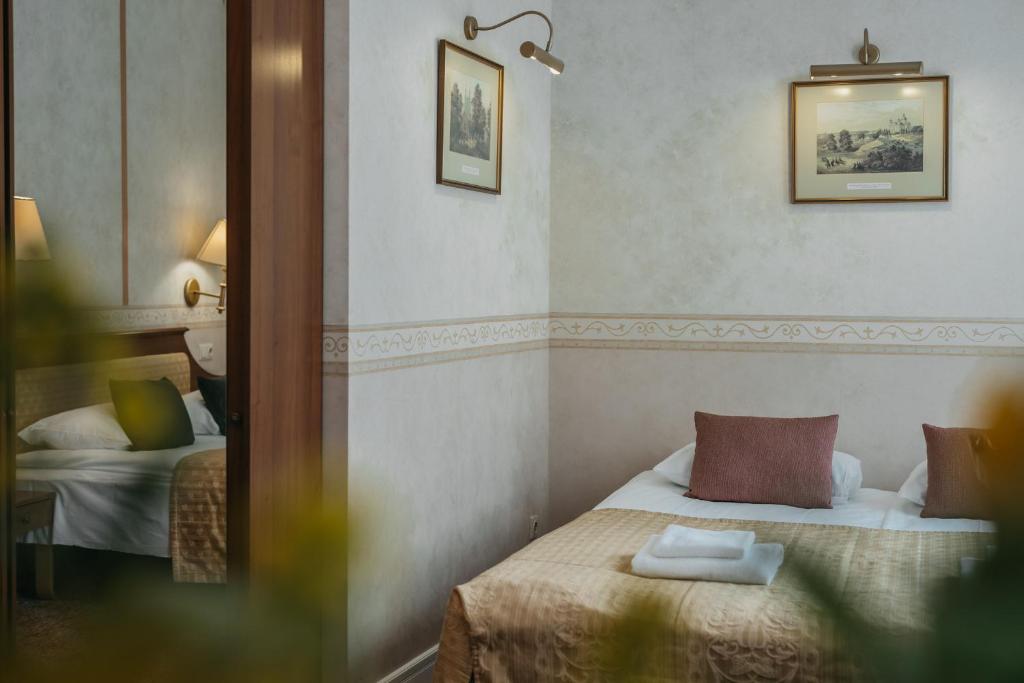 Postel nebo postele na pokoji v ubytování Hotel Rinno