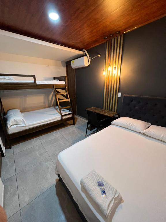 Postel nebo postele na pokoji v ubytování Hotel Almalu