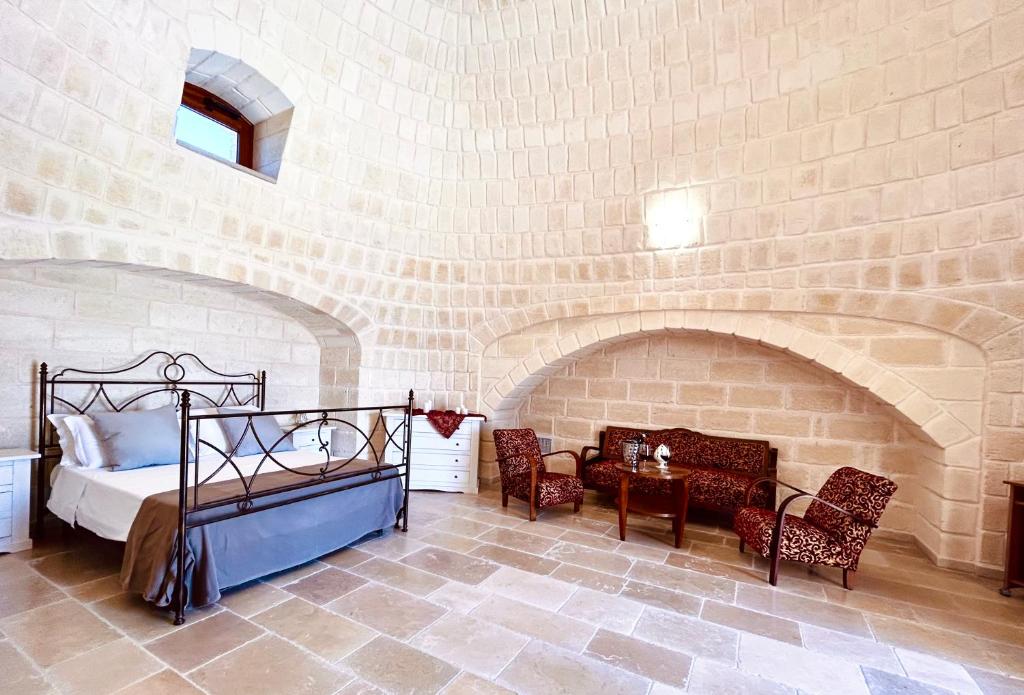Postel nebo postele na pokoji v ubytování Trullo Li Demani by Jdvacanze