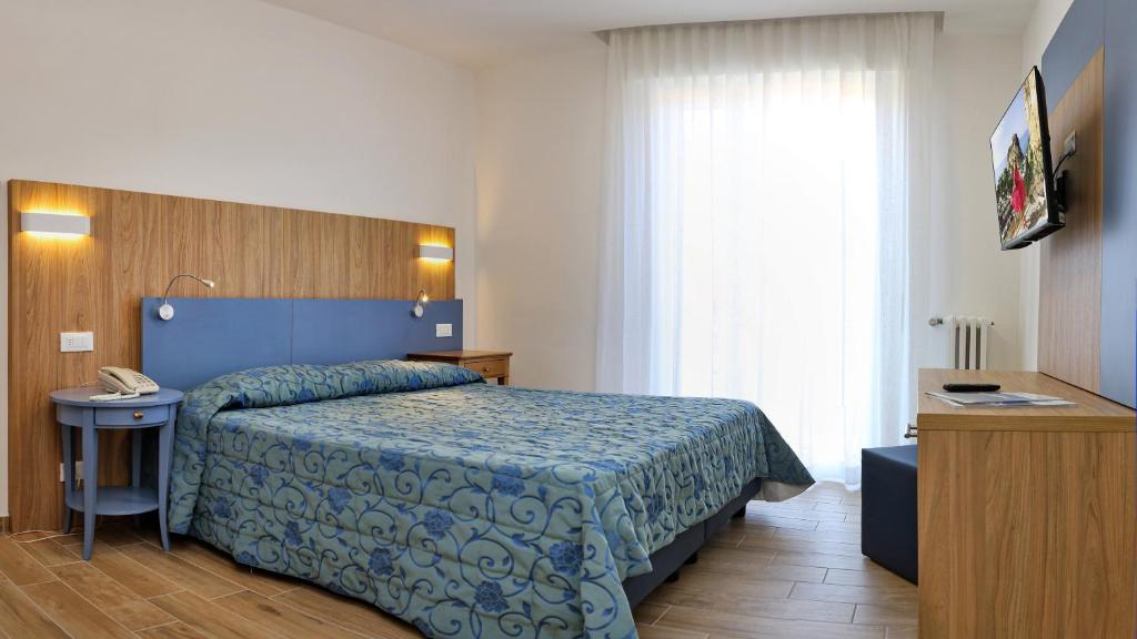 Postel nebo postele na pokoji v ubytování Hotel Marina