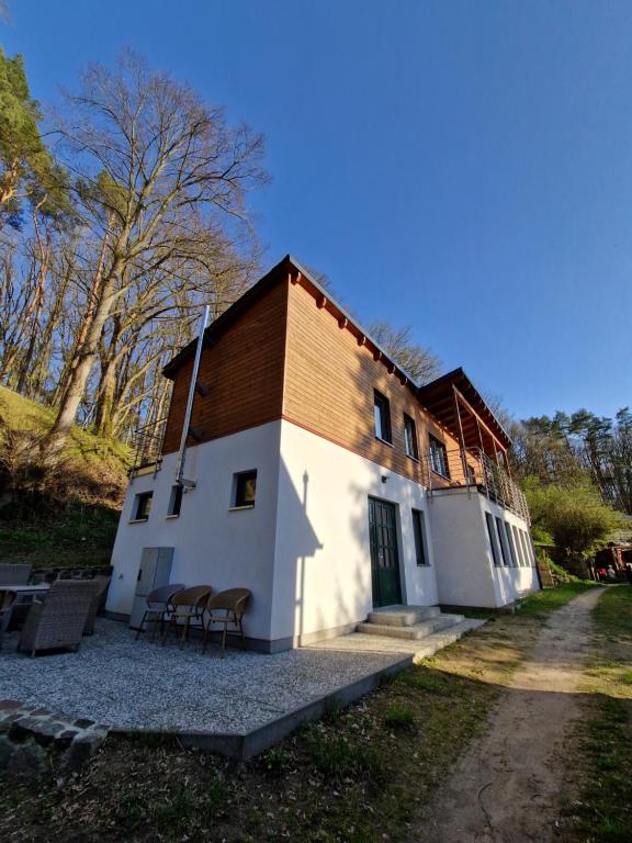 a white building with a brown roof at Sonnenhaus in Joachimsthal