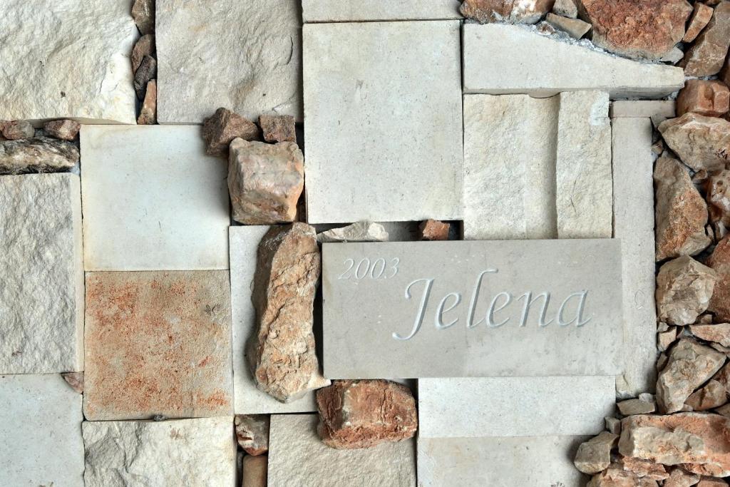 a sign that says jezena on a stone wall at Jelena Sumartin in Sumartin