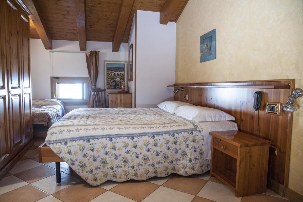 Postel nebo postele na pokoji v ubytování Casa Hellen