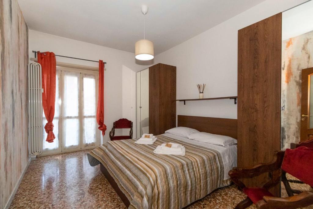 Postel nebo postele na pokoji v ubytování Torino Pitagora Functional Flat
