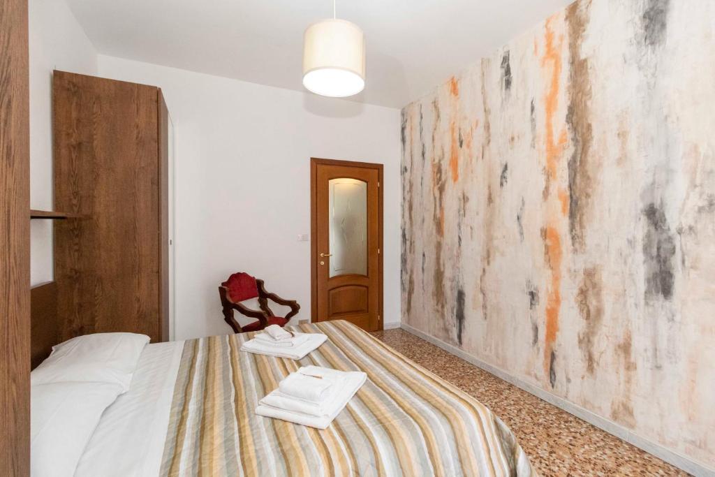 Postel nebo postele na pokoji v ubytování Torino Pitagora Functional Flat