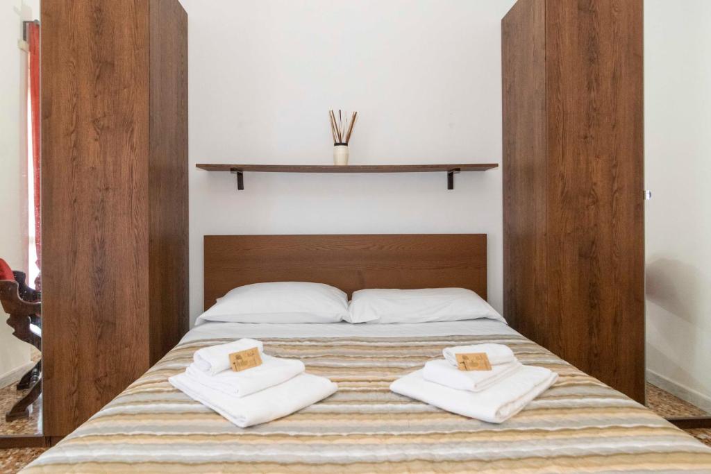 Postel nebo postele na pokoji v ubytování Torino Pitagora Functional Flat