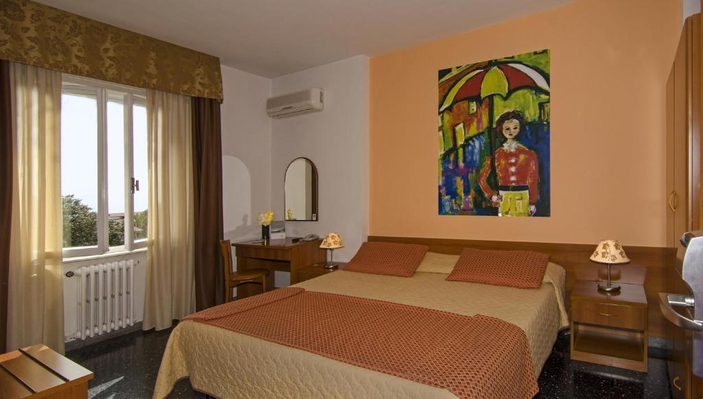 Postel nebo postele na pokoji v ubytování Hotel Scandinavia
