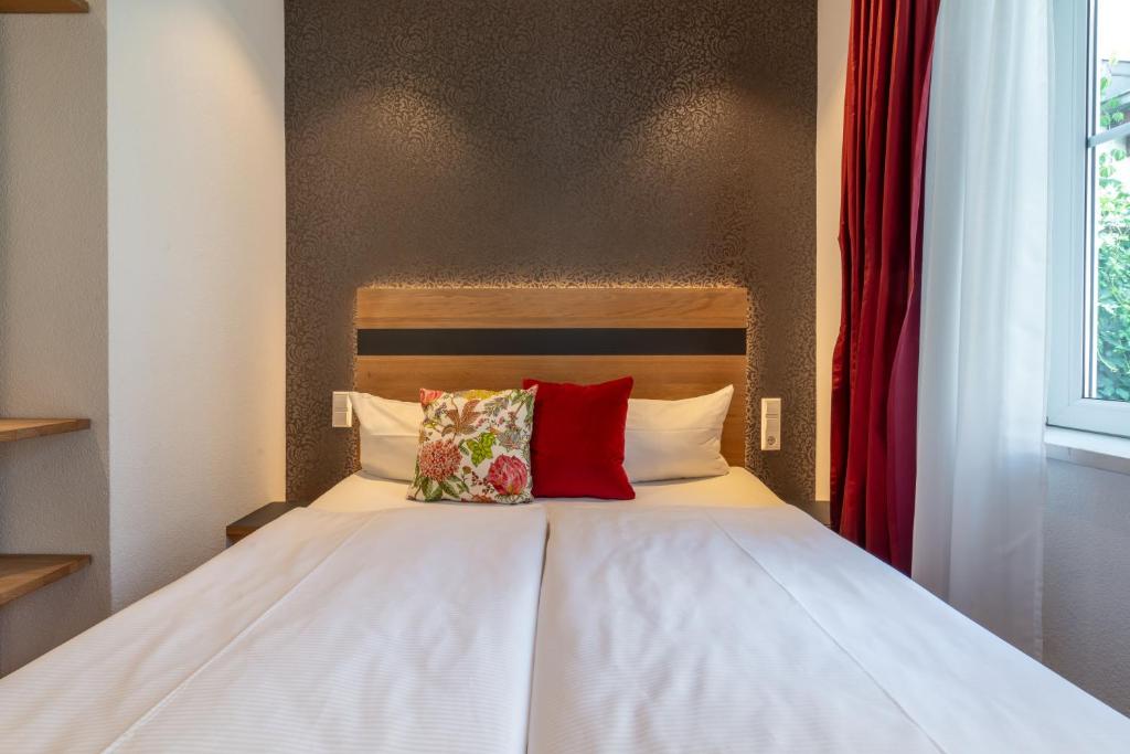 Postel nebo postele na pokoji v ubytování Hotel am Fischmarkt