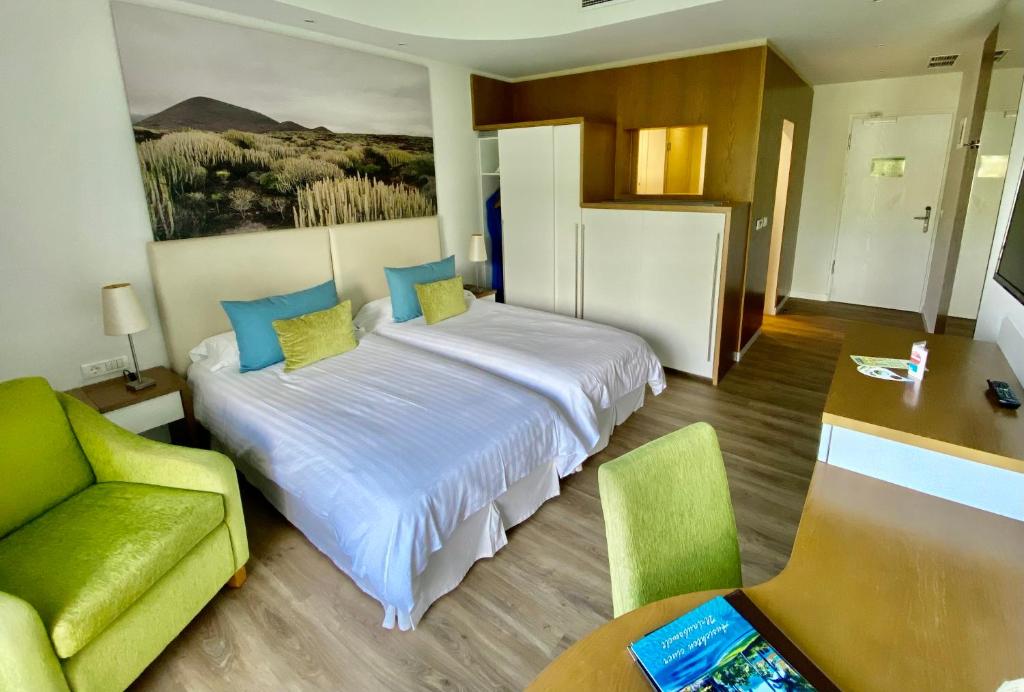 Postel nebo postele na pokoji v ubytování Hotel Tigaiga
