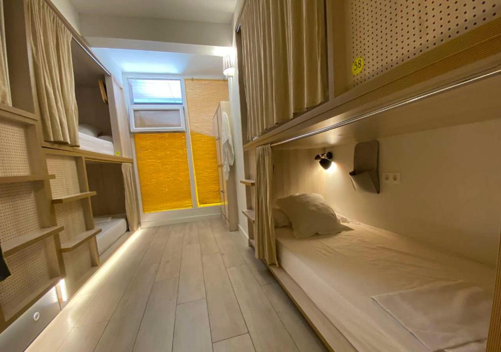 Postel nebo postele na pokoji v ubytování Blai Blai Hostel