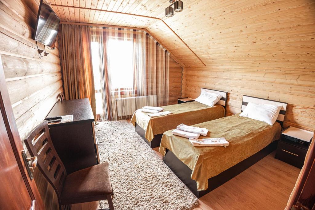 Postel nebo postele na pokoji v ubytování Готель Чарда