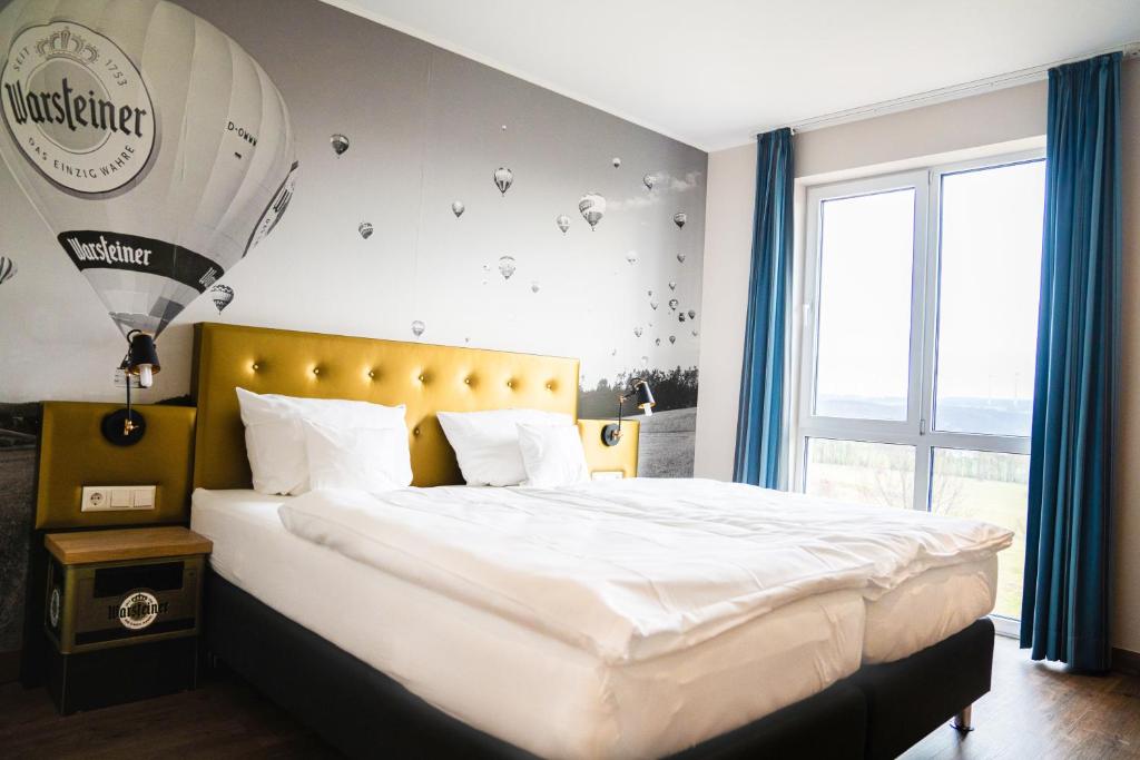 Postel nebo postele na pokoji v ubytování AiREA Hotel