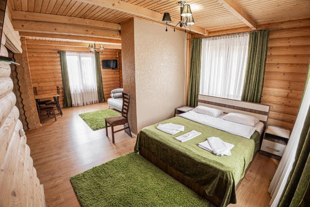 Postel nebo postele na pokoji v ubytování Готель Чарда