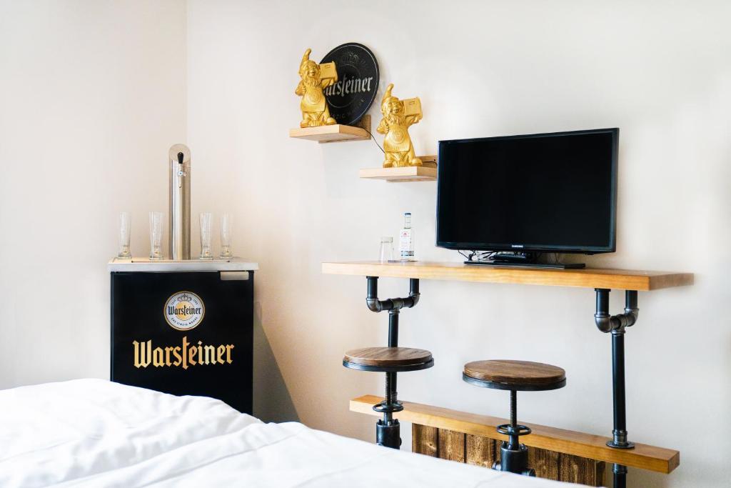 TV a/nebo společenská místnost v ubytování AiREA Hotel