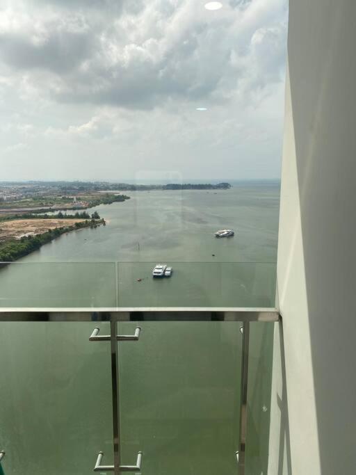 a view of a river with two boats in the water at Peaceful Sea view Cozy APT at Batam Center - By MESA in Batam Center