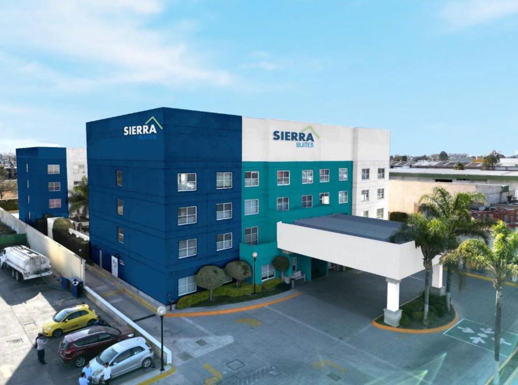 a rendering of a siesta hotel in a parking lot at Sierra Suites By HP Hotels in San Luis Potosí