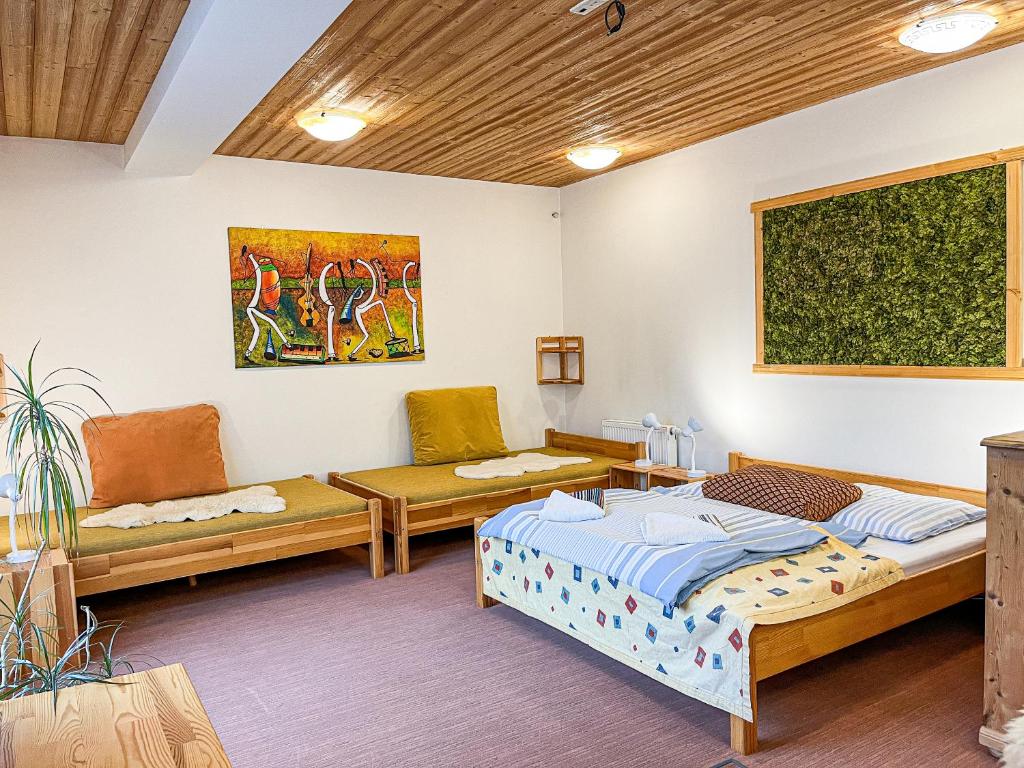 A bed or beds in a room at Apartmány Limba