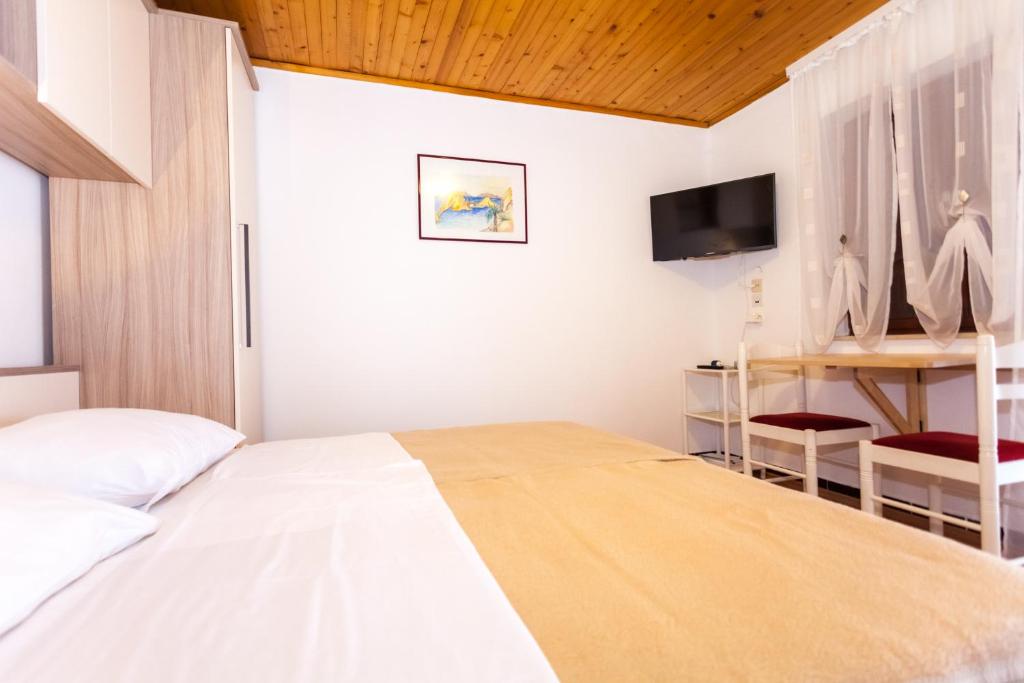 Postel nebo postele na pokoji v ubytování Villa Croatia