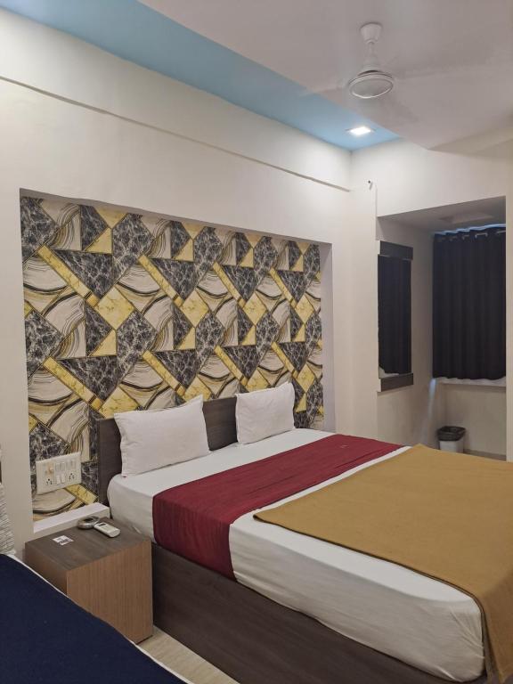Postel nebo postele na pokoji v ubytování Hotel Gitanjali