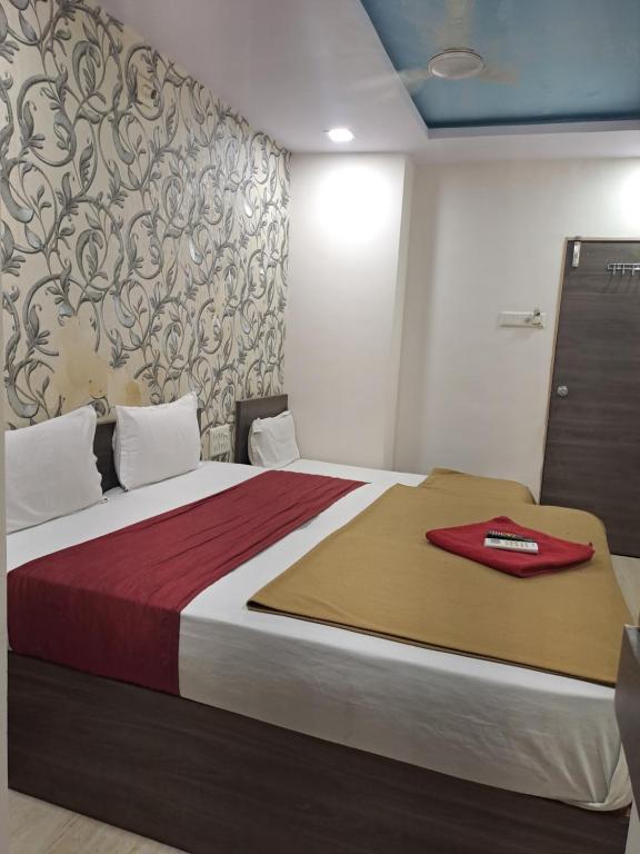 Postel nebo postele na pokoji v ubytování Hotel Gitanjali