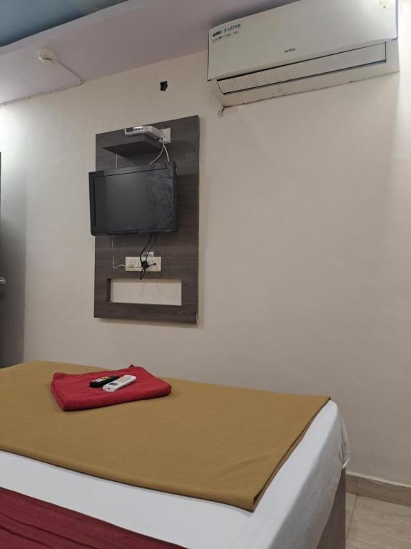 Postel nebo postele na pokoji v ubytování Hotel Gitanjali