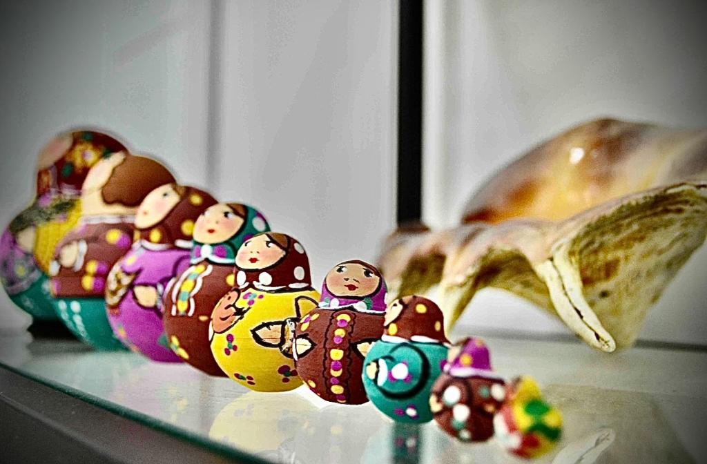 a group of toy figurines on a glass table at نزل الشاطئ in Ḩayl Āl ‘Umayr