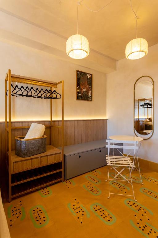 a bedroom with a bunk bed and a table at Studio Savana in São Paulo