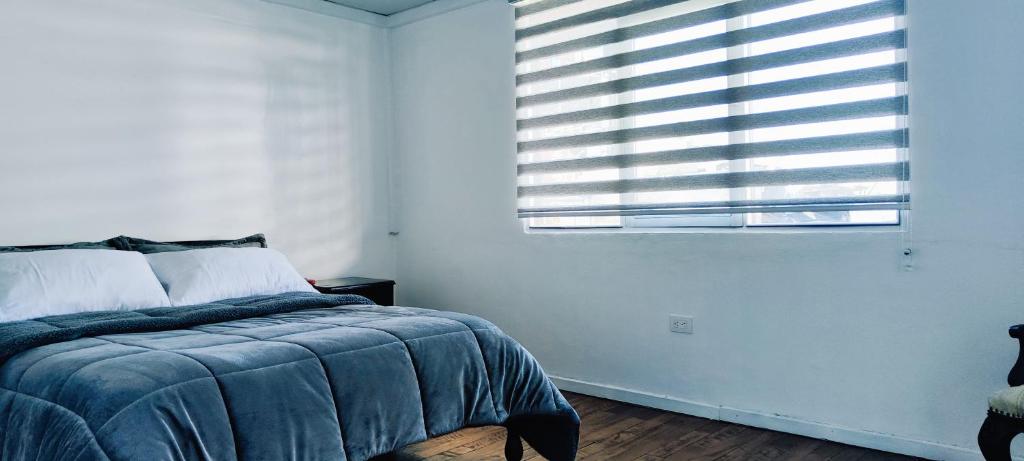 Postel nebo postele na pokoji v ubytování Hotel Muros Quito