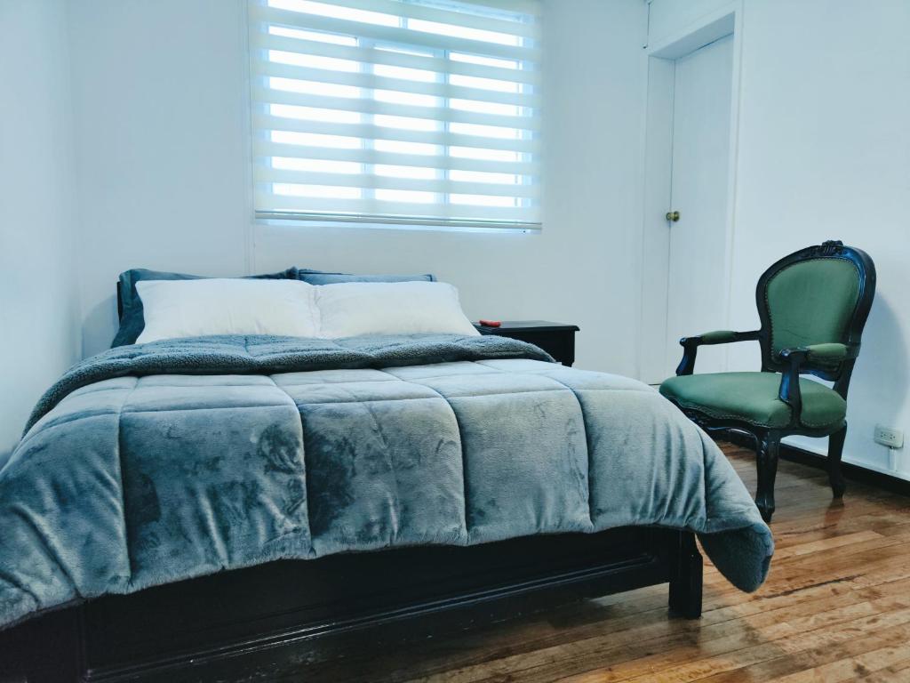 Postel nebo postele na pokoji v ubytování Hotel Muros Quito