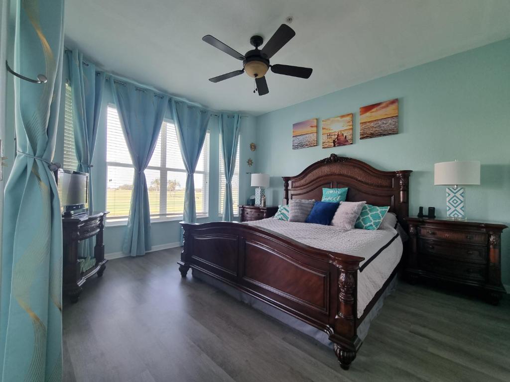 a bedroom with a bed with a ceiling fan at Greenlinks 923 at Lely Resort - Luxury 2 Bedrooms & Den Condo in Naples