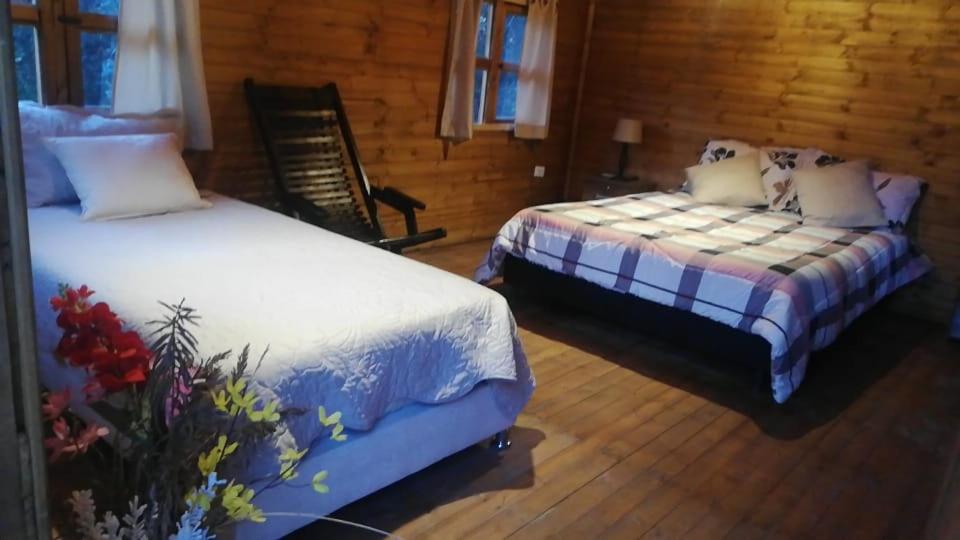 Postel nebo postele na pokoji v ubytování Mundo Nuevo Cabañas