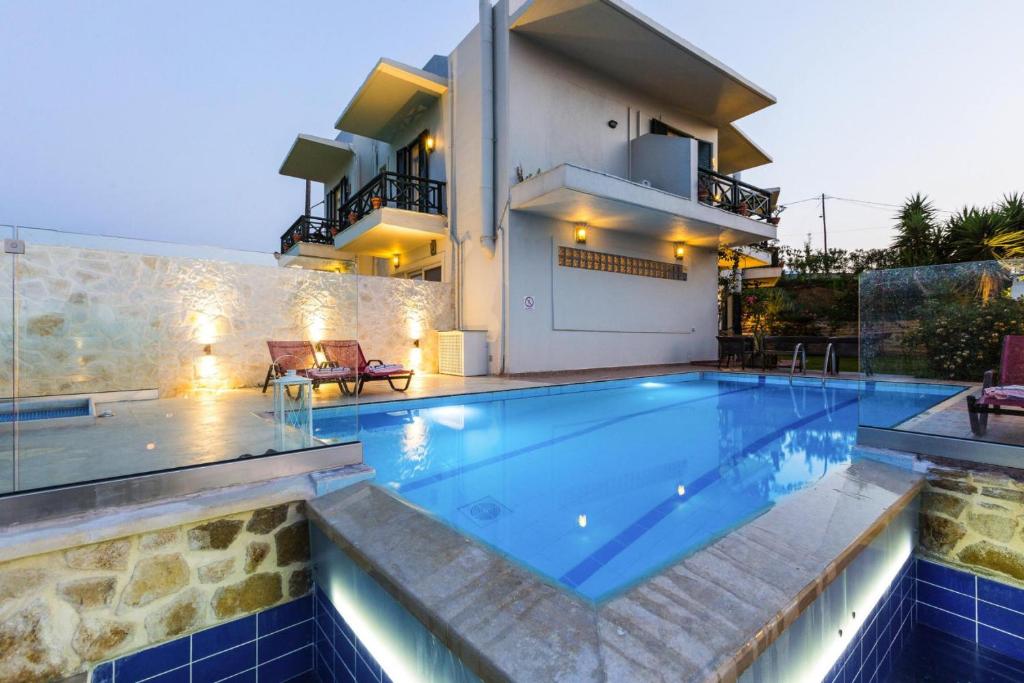 a swimming pool in front of a villa at Villa in Episkopi with private pool in episkopi-chania