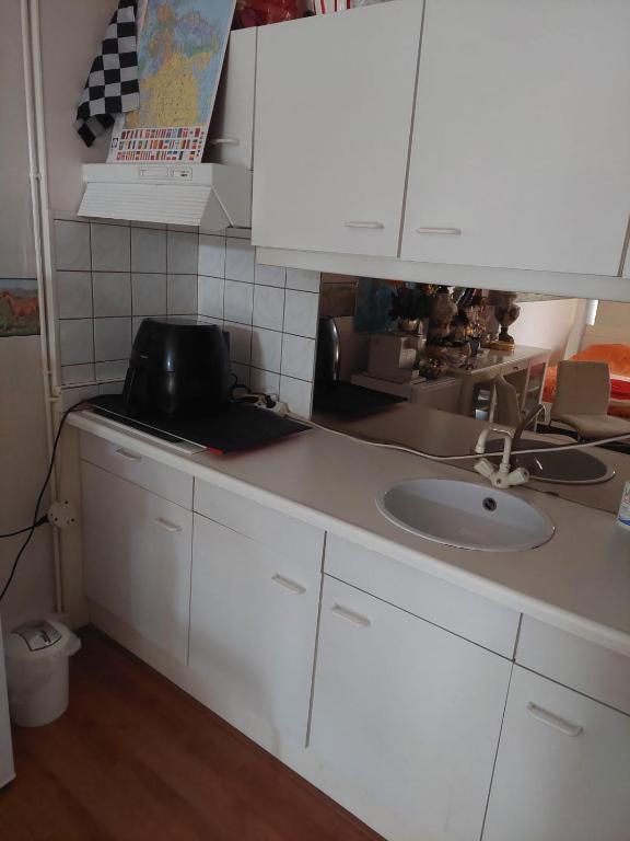 Kuchyň nebo kuchyňský kout v ubytování Mooi uitzicht appartement te huur tijdens de GP in Zandvoort