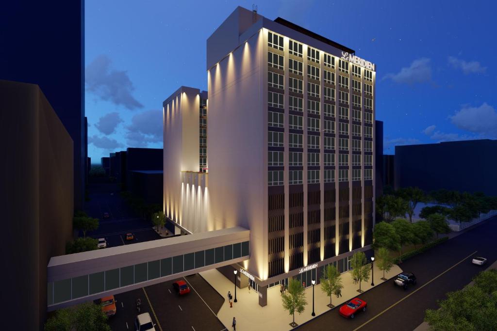 a rendering of a tall building with lights on at Le Méridien Fort Worth Downtown in Fort Worth