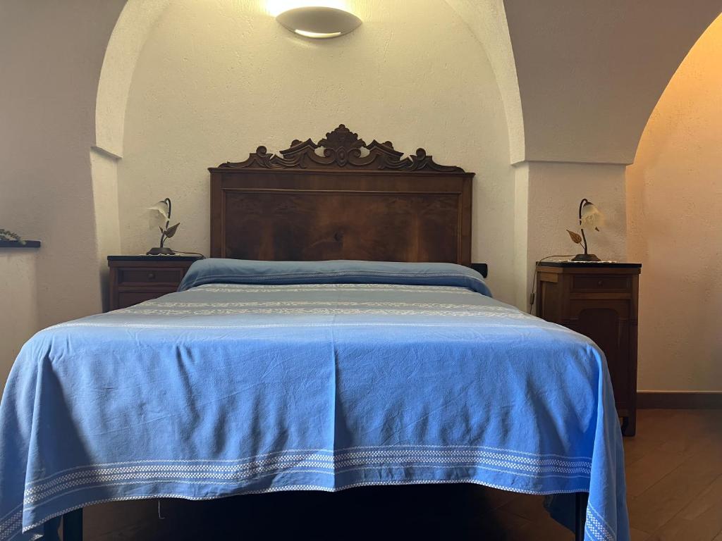 A bed or beds in a room at Bed & Breakfast L'erica